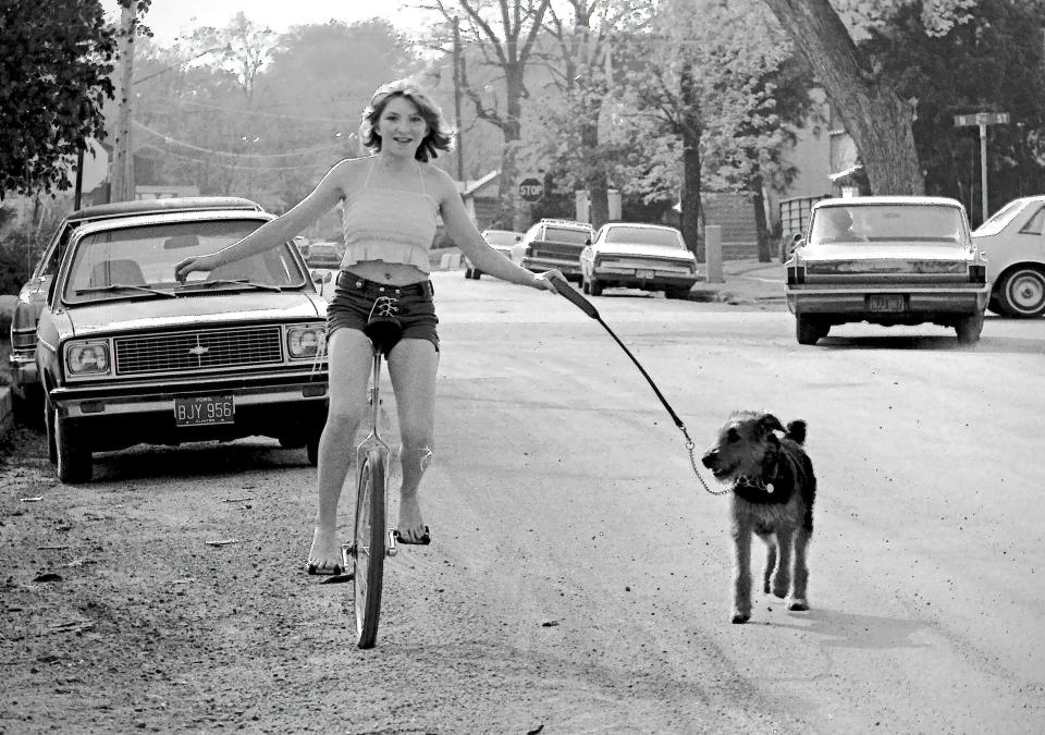 At age 12 in Clinton, Iowa, the Social Butterfly columnist Kristi K. Higgins of Chester, Va. walks her Airedale Terrier Brandy aka Bengal Tarkus Tike.