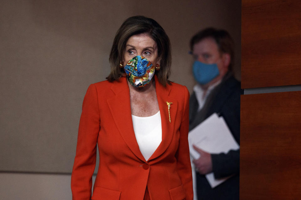 House Speaker Nancy Pelosi of Calif., wears a face mask as she arrives to speak at a news conference on Capitol Hill in Washington, Friday, June 26, 2020. (AP Photo/Carolyn Kaster)