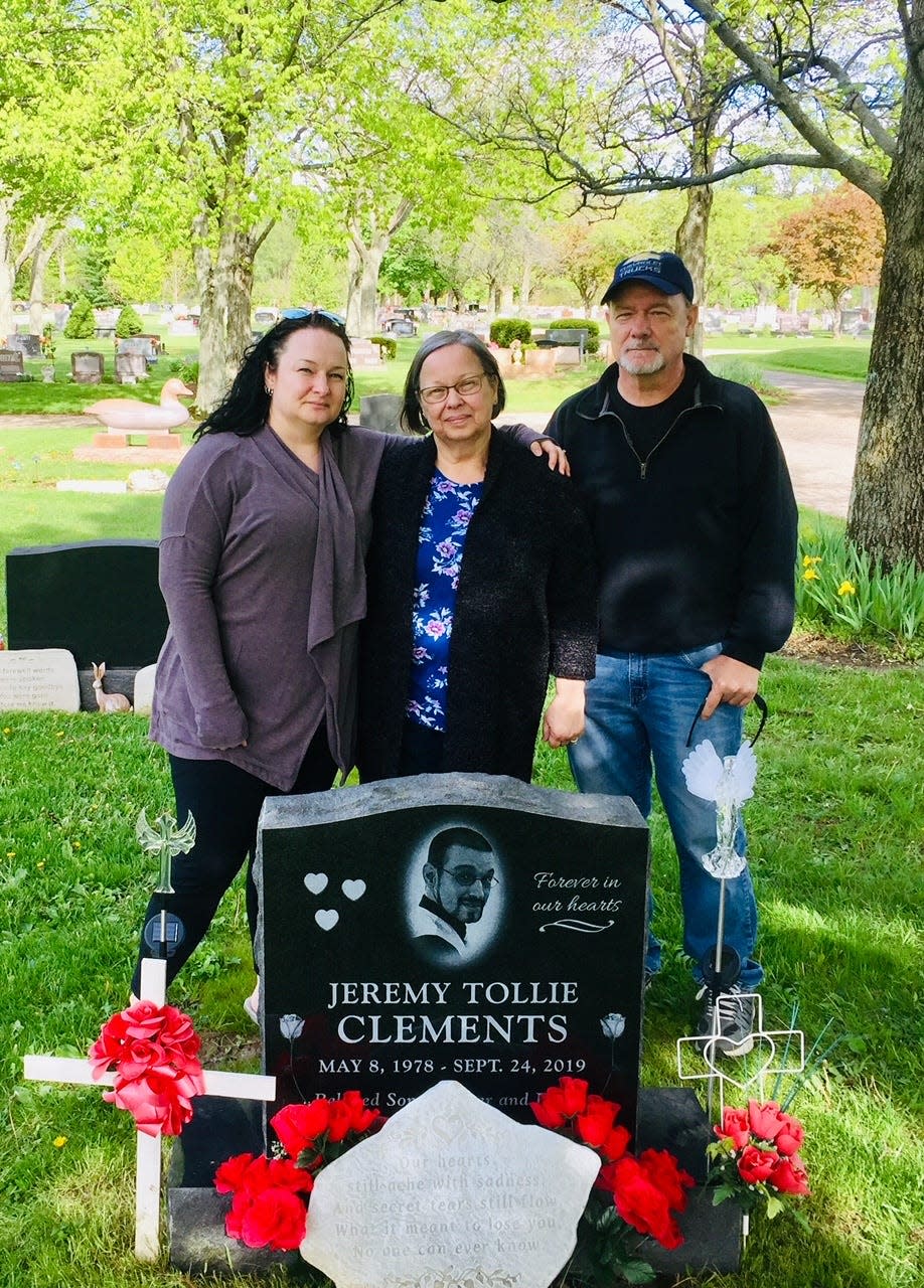 Clements family members, Jessica Chapman, his sister, and Brenda and Randy Clements, his parents, visit Jeremy’s grave where they mourn and remember their son and brother who was murdered in 2019. "You never move on, you never forget, and you never heal," Jessica says of the tragedy. "All you can do is simply try to find a new normal."