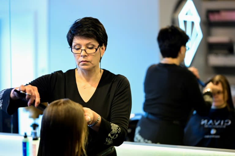 Ukrainian hairdresser Valentyna Vysotska is employed in Berlin after a 10-month crash course to learn German (Tobias SCHWARZ)