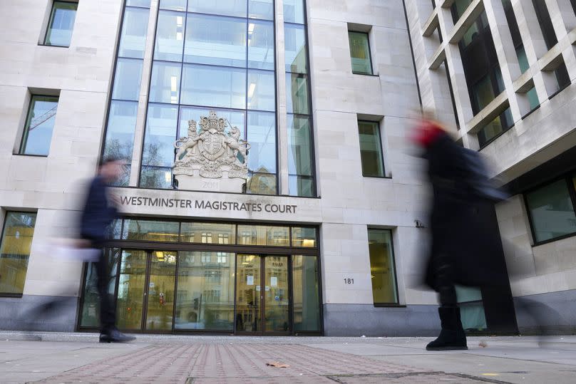 People pass by Westminster Magistrates Court in London, Tuesday, Jan. 17, 2023.