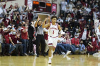Indiana's Rob Phinisee (1) reacts after hitting a three-point basket during the first half of an NCAA college basketball game against Purdue, Thursday, Jan. 20, 2022, in Bloomington, Ind. (Darron Cummings)