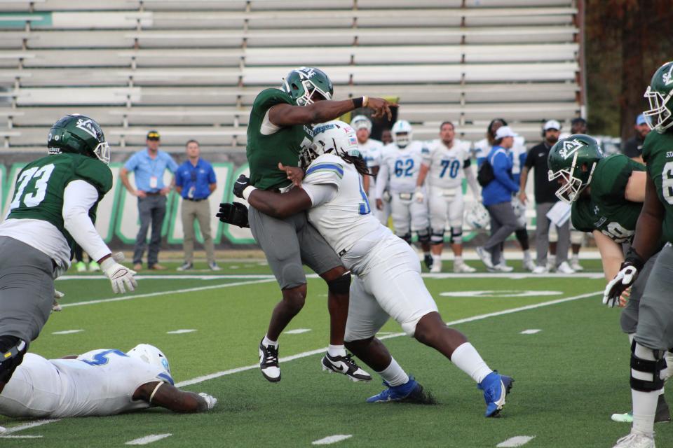 West Florida defensive lineman Justice Williams hits Delta State quarterback Patrick Shegog during the Argos' 24-21 win on Saturday, Oct. 21, 2023 from Parker Field at McCool Stadium in Cleveland, Mississippi.