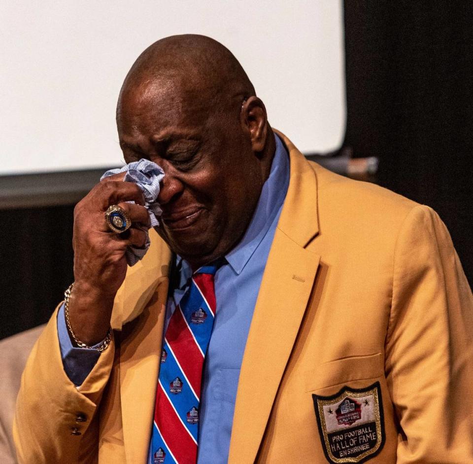 Larry Little wipes tears from his eyes during a ceremony held at the Booker T. Washington High School auditorium on March 27. Northwest 14th Street between Seventh Avenue and First Avenue is now “Larry C. Little Street.”