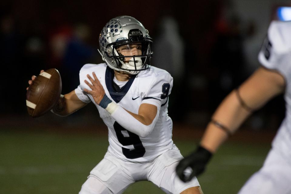 Reitz's Roland Vera Jr (9) looks to throw a pass as the Reitz Panthers play the Memorial Tigers at Enlow Field in Evansville, Ind., Friday evening, Sept. 30, 2022. 