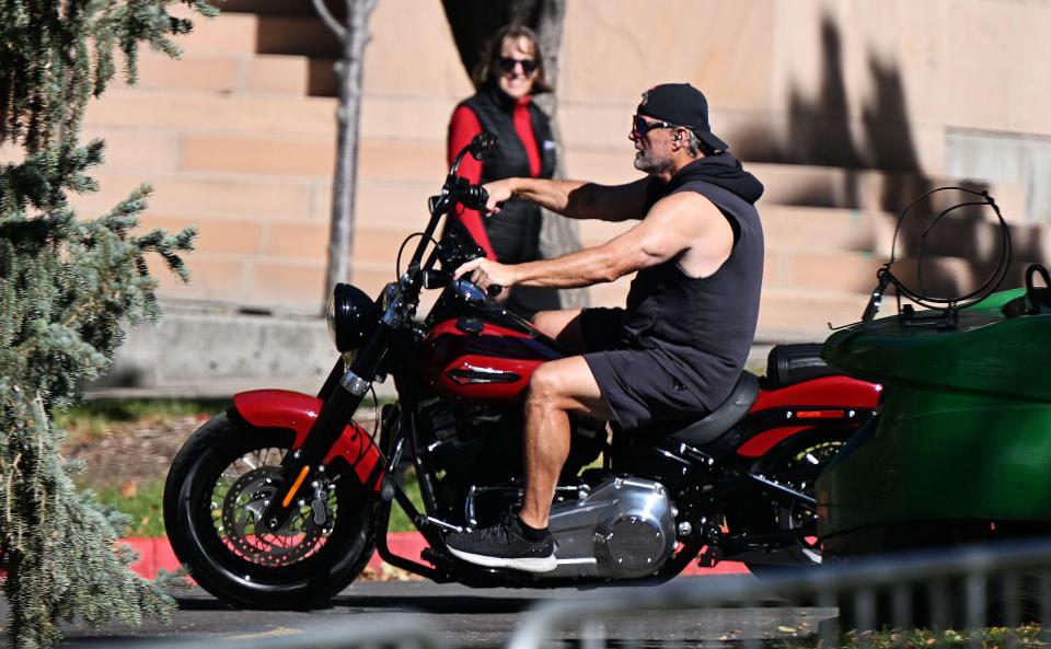 Utah head coach Kyle Whittingham rides a motorcyle.