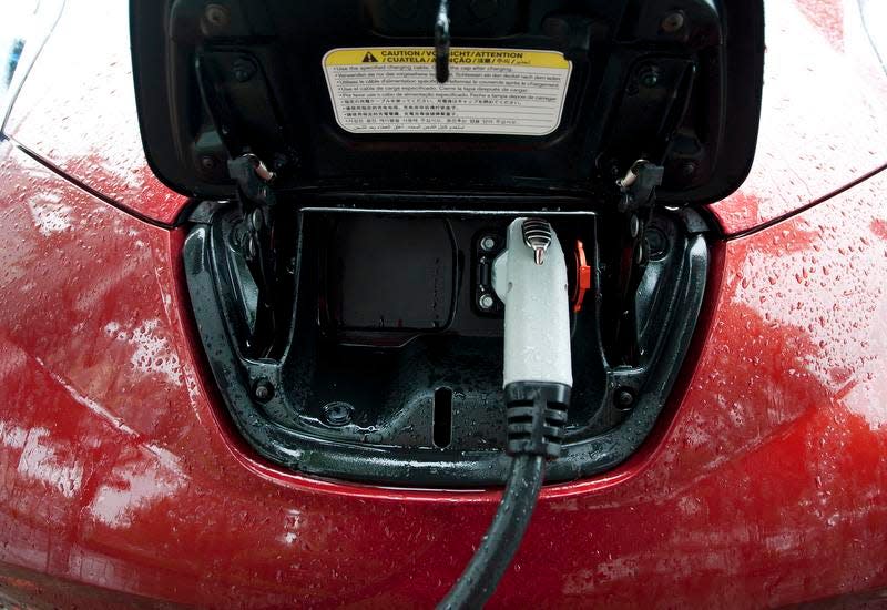 A Nissan Leaf, an electric vehicle, at a charging station on Main Street in Burlington.