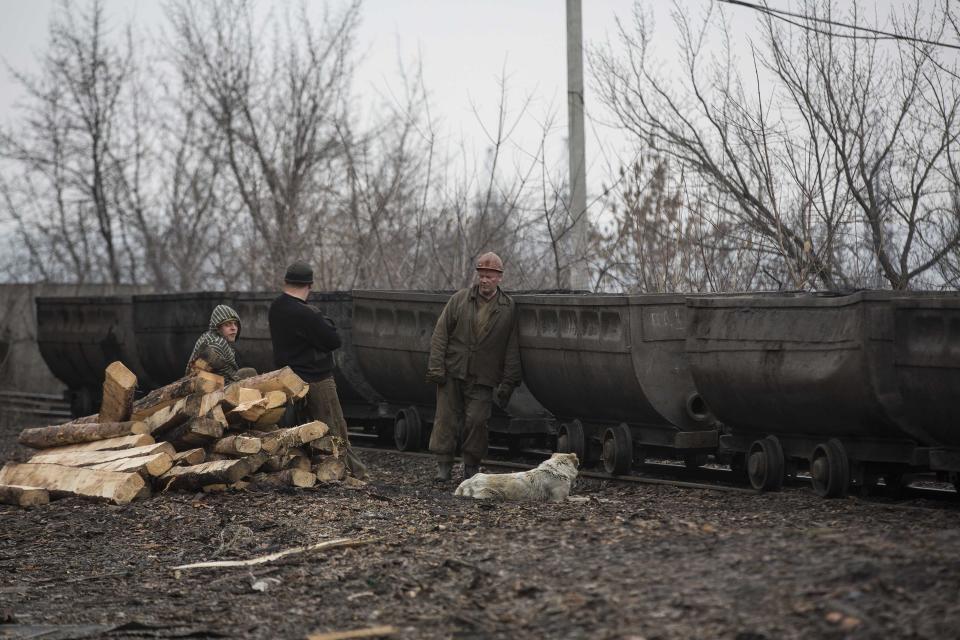 Miners stand outside Zasyadko coal mine in Donetsk