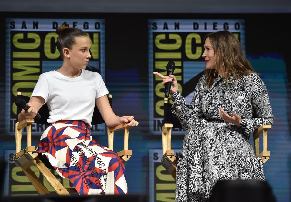 Actress Millie Bobby Brown (L) and Vera Farmiga participate in the Warner Bros. Theatrical Panel for "Godzilla: King of the Monsters" during Comic Con in San Diego, July 21, 2018. (Photo by CHRIS DELMAS / AFP)        (Photo credit should read CHRIS DELMAS/AFP/Getty Images)