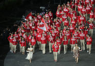 LONDON, ENGLAND - JULY 27: Simon Whitfield of the Canada Olympic triathlon team carries his country's flag during the Opening Ceremony of the London 2012 Olympic Games at the Olympic Stadium on July 27, 2012 in London, England. (Photo by Clive Rose/Getty Images)