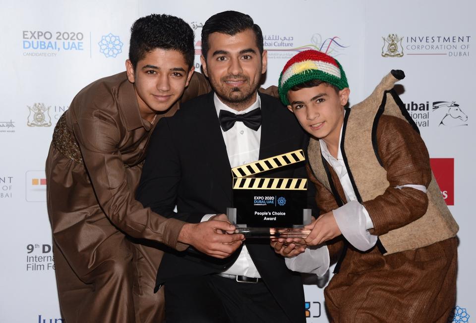 DUBAI, UNITED ARAB EMIRATES - DECEMBER 16: Actor Sarwar Fazil, director Karzan Kader and actor Zamand Taha with their People Choice award during the Closing Ceremony on day eight of the 9th Annual Dubai International Film Festival held at the Madinat Jumeriah Complex on December 16, 2012 in Dubai, United Arab Emirates. (Photo by Andrew H. Walker/Getty Images for DIFF)