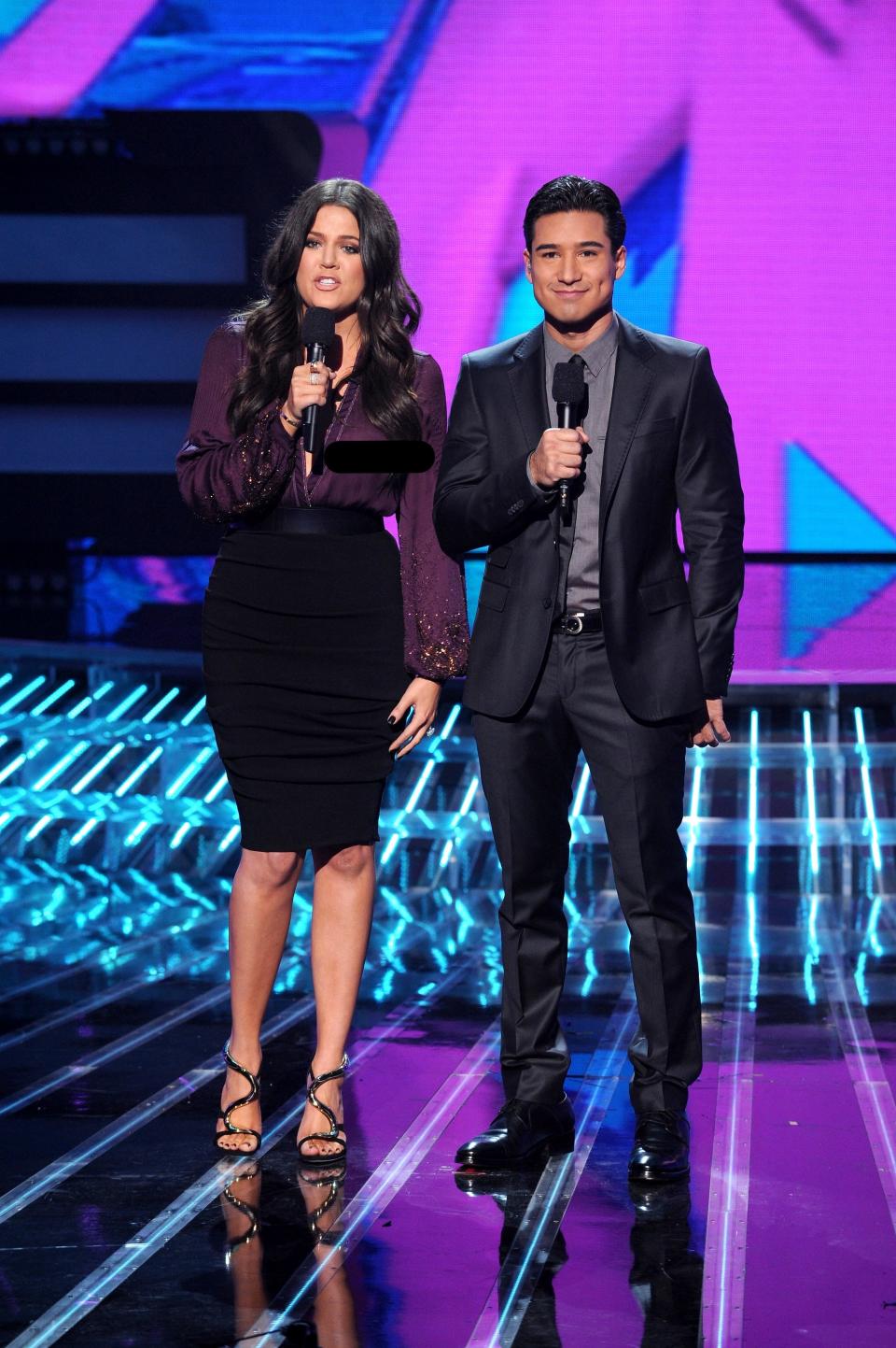 Khloe Kardashian co-hosting "The X Factor" with Mario Lopez in 2012.