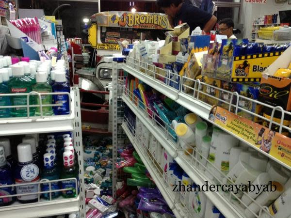 A passenger jeepney lost its brakes and hit a Mercury Drug store in Taft corner Padre Faura in Manila on September 12. Fortunately, no one was hurt in the incident. Photos from Zhander Cayabyab, used with permission.