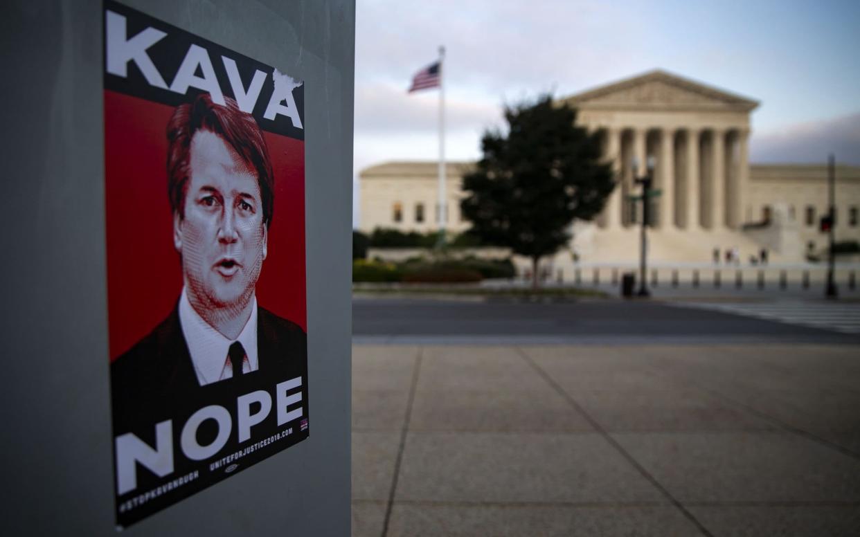 A sticker in protest of Brett Kavanaugh  is seen outside of the U.S. Supreme Court building in Washington, D.C. - Bloomberg