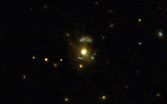 This image taken with the NASA/ESA Hubble Space Telescope shows the galaxy 3C 297, which was part of a large survey of galaxies that sought to confirmed the link between mergers and galaxies hosting relativistic jets from supermassive black hol