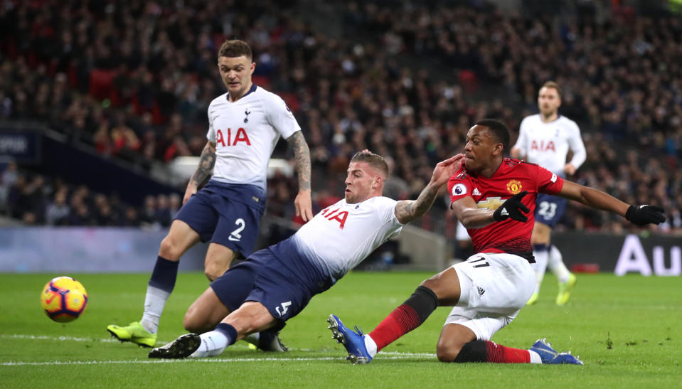 Tottenham Hotspur’s Toby Alderweireld (left) slides in as Manchester United’s Anthony Martial fires in a shot