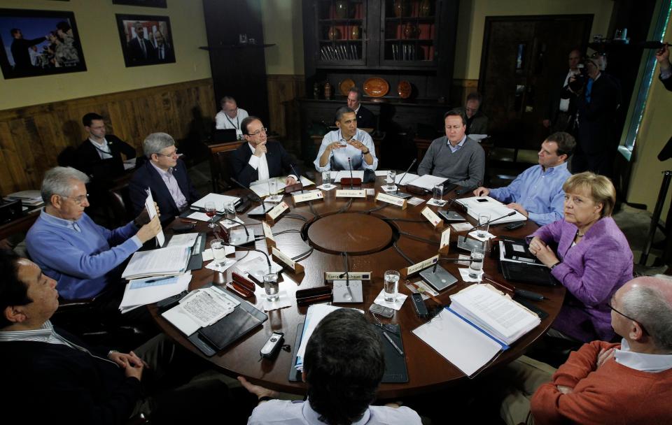 President Barack Obama, center, leads the first meeting with world leaders at the start of the first session of the G-8 Summit, May 19, 2012, at Camp David, Md.