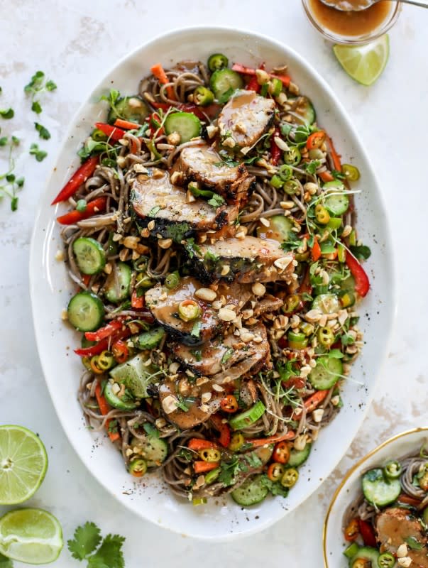 <p>This grilled thai pork tenderloin is so easy, super flavorful, and the perfect weeknight meal when you serve it with a soda noodle salad.</p><p><strong>Get the recipe: <a href="https://www.howsweeteats.com/2019/05/grilled-thai-pork-tenderloin/" rel="nofollow noopener" target="_blank" data-ylk="slk:Grilled Thai Pork Tenderloin;elm:context_link;itc:0;sec:content-canvas" class="link rapid-noclick-resp"><em>Grilled Thai Pork Tenderloin</em></a></strong></p>