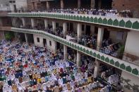 <p>Indian Muslims offer Eid prayers on the occasion of the Eid al-Fitr festival which marks the end of the holy month of Ramadan at the Kharudin Mosque in Amritsar on July 7, 2016. The three-day festival, which begins after the sighting of a new crescent moon, marks the end of the fasting month of Ramadan during which devout Muslims abstain from food and drink from dawn to dusk. </p>