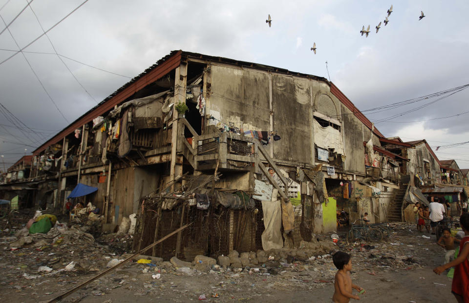 In this photo taken Dec. 4, 2012, the area where Filipino slum dweller Jessa Balote lives at a place called Aroma in Tondo, Manila, Philippines. Balote, who used to tag along with her family as they collect garbage at a nearby dumpsite, is a scholar at Ballet Manila's dance program. As an apprentice, she makes around 7,000 pesos ($170) a month, sometimes double that, from stipend and performance fees. (AP Photo/Aaron Favila)