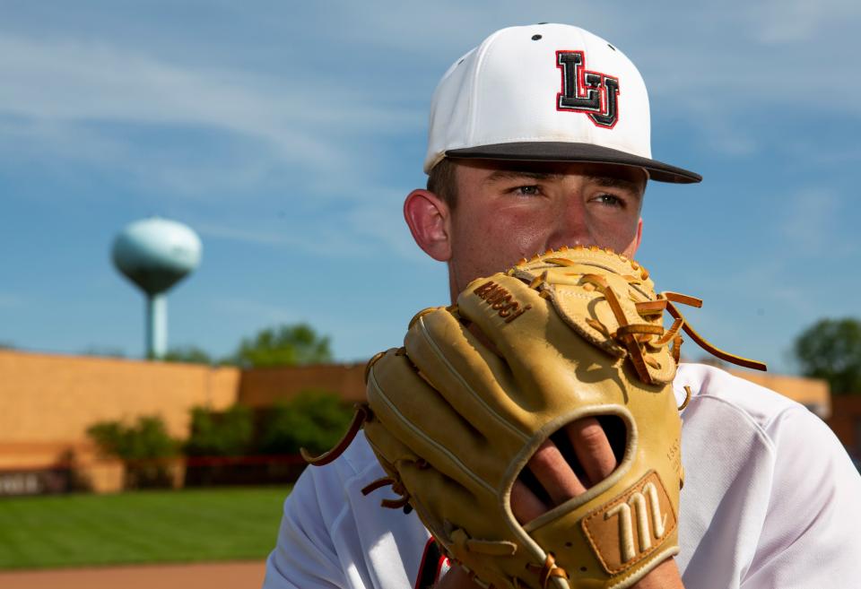 Liberty Union senior Jacob Miller stands on the pitchers mound on the baseball diamond at Liberty Union High School in Baltimore, Ohio on May 11, 2022. Jacob has been scouted for his pitching talents by Major League Baseball scouts and early projections show he will be drafted in the first round of the Major League Baseball Draft in July 2022.