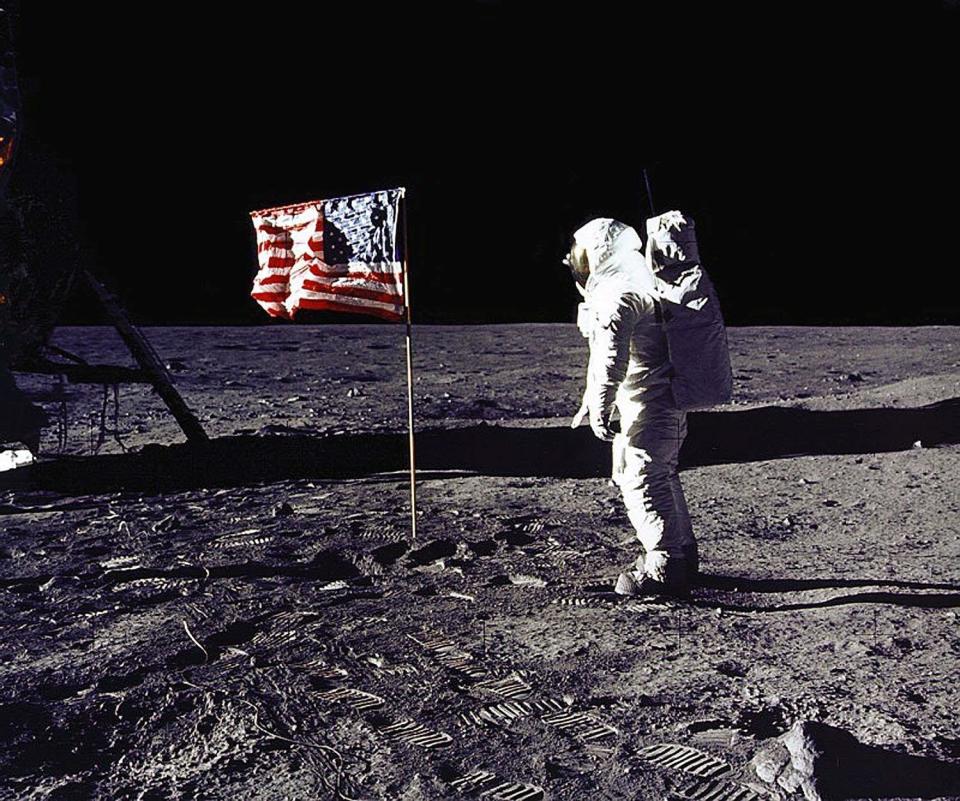 This July 20, 1969 file photo released by NASA shows astronaut Edwin E. 'Buzz' Aldrin, Jr. saluting the U.S. flag on the surface of the moon during the Apollo 11 lunar mission.