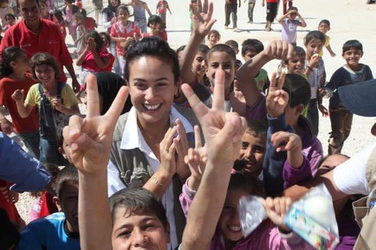 Tunisian actress Hind Sabri visits a refugee camp at the Jordanian borders allocated for Syrians fleeing the civil war.