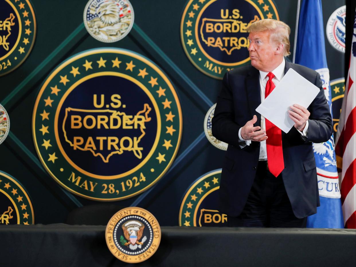 Donald Trump stands up to leave after participating in a roundtable briefing on border security at the Border Patrol Yuma Station in Arizona, June 23, 2020. (REUTERS)
