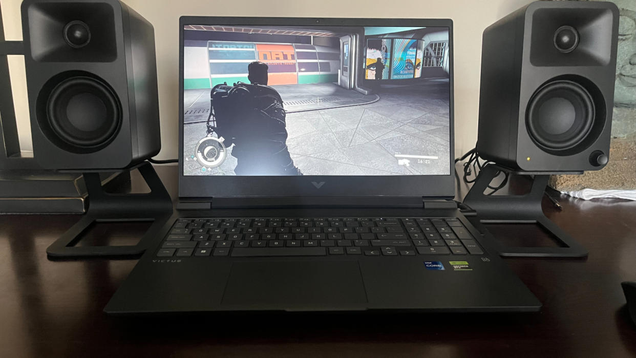  HP Victus 16 gaming laptop on a desk playing a game. 