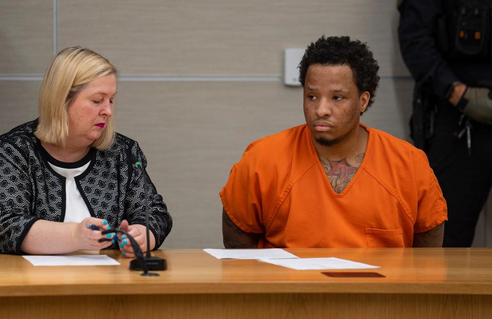 Attorney Deana Martin (left) represents Orlando Mitchell at an initial court hearing Friday, July 14, 2023, at the Marion County Community Justice Campus in Indianapolis. Mitchell is charged with two counts of murder, one count of robbery resulting in serious bodily injury and one count of escape in the July 10 death of Marion County Deputy John Durm. Mitchell is accused of fatally strangling Durm with his handcuff chain before stealing a jail transport van and crashing it in an escape attempt.