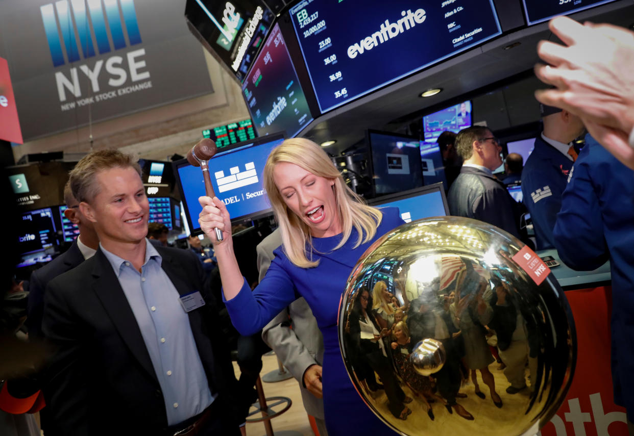 Eventbrite Inc. CEO Julia Hartz stands next to her husband Kevin Hartz, Co-Founder and Chairman of Eventbrite, as she rings a ceremonial bell to celebrate their company's IPO at the New York Stock Exchange (NYSE) in New York, U.S., September 20, 2018. REUTERS/Brendan McDermid