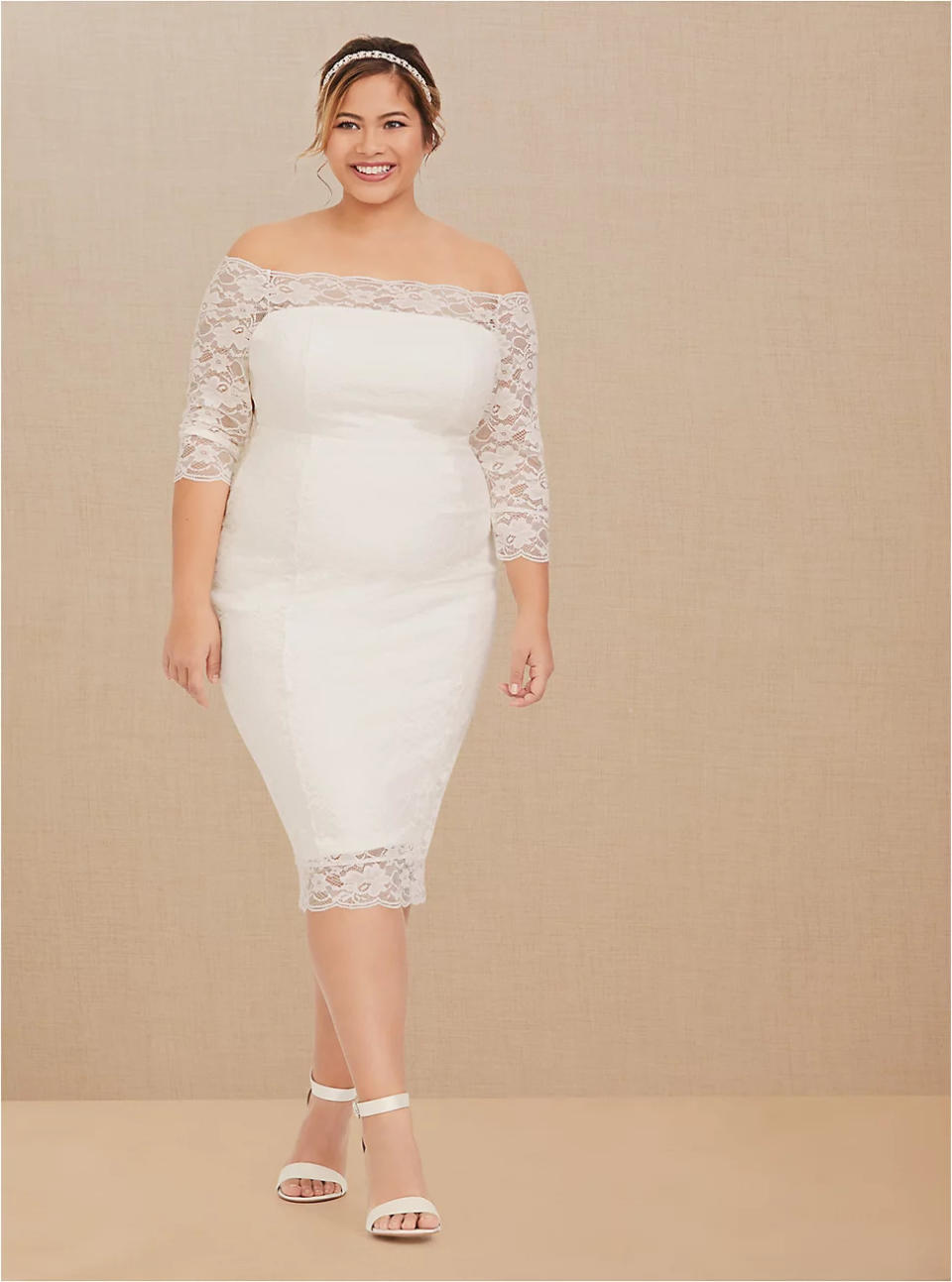 Ivory Lace Off Shoulder Bodycon Dress. Image via Torrid.