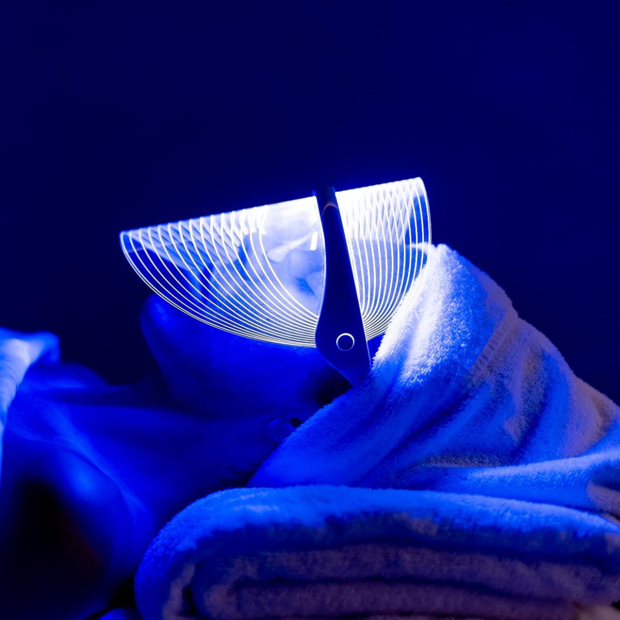  women using blue led light therapy for acne 