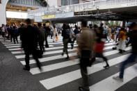 FILE PHOTO: Commuters pictured at a pedestrian crossing in Osaka