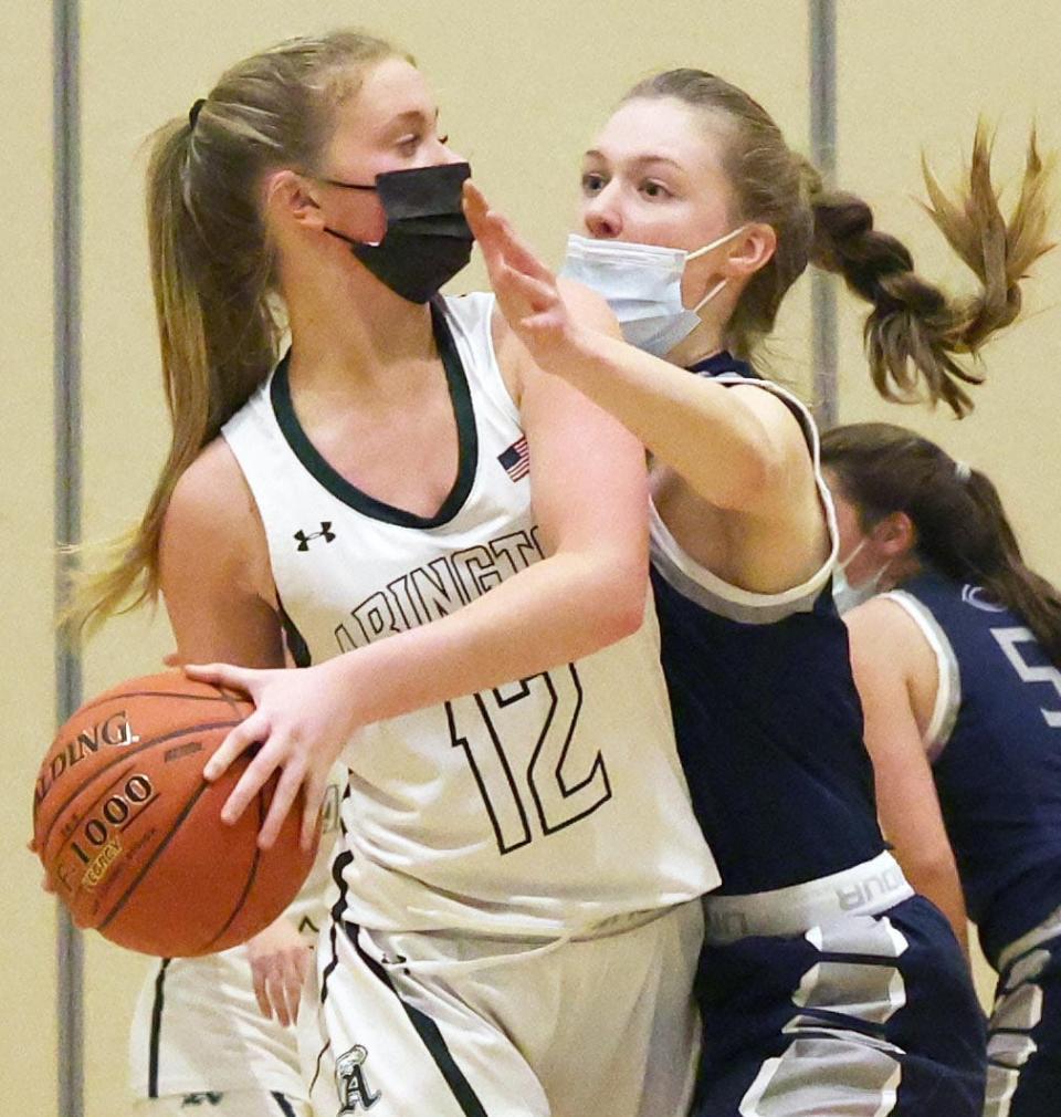 Cohasset defender Abby Goff, right, puts pressure on Abington's Sarah Deveney during a game on Tuesday, Jan. 4, 2022.