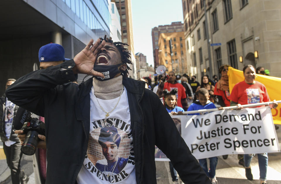 FILE — Tehilah Spencer, the brother of the late Peter Spencer leads a rally calling for justice in his brother's death, in downtown Pittsburgh, Feb. 21, 2022. Venango County District Attorney D. Shawn White said Tuesday, that Peter Spencer was fatally shot while he was high on psychedelic mushrooms, and firing an assault rifle while threatening others at a cabin in Venango County in December 2021. No charges will be filed. (Pittsburgh Post-Gazette via AP, File)