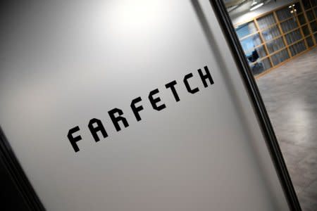 FILE PHOTO - Branding for online fashion house Farfetch is seen at the company headquarters in London, Britain January 31, 2018. REUTERS/Toby Melville