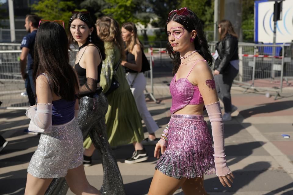 Fans arrive for the Taylor Swift concert at the Paris Le Defense Arena as a part of her Eras Tour concert in Paris, Thursday, May 9, 2024. (AP Photo/Lewis Joly)