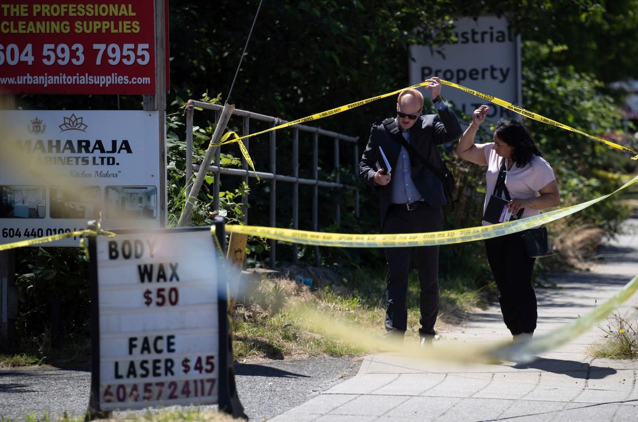 Investigators arrive at the scene of a fatal shooting, in Surrey, British Columbia., on Thursday, July 14, 2022. Ripudaman Singh Malik, the man acquitted in a terrorist bombing that killed 329 people aboard an Air India flight in 1985 was the person slain Thursday in what Canadian authorities described as a possible targeted shooting, his family said. 