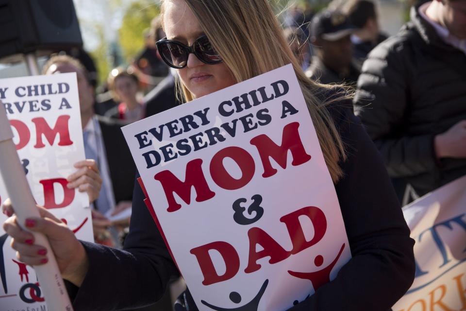 A woman participates in a protest in Washington after the Supreme Court’s ruling on same-sex marriage in 2015. <a href="https://media.gettyimages.com/photos/opponents-of-samesex-marriage-demonstrate-near-the-supreme-court-28-picture-id471432028?s=2048x2048" rel="nofollow noopener" target="_blank" data-ylk="slk:Drew Angerer/Getty Images;elm:context_link;itc:0;sec:content-canvas" class="link ">Drew Angerer/Getty Images</a>