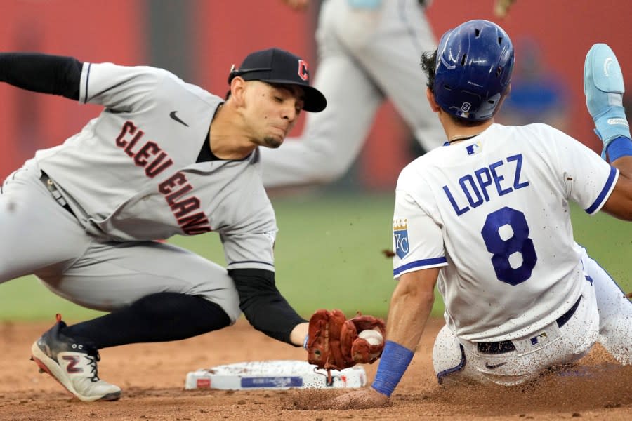 Kansas City Royals’ Nicky Lopez (8) is caught stealing second by Cleveland Guardians second baseman Andres Gimenez during the third inning of a baseball game Tuesday, June 27, 2023, in Kansas City, Mo. (AP Photo/Charlie Riedel)