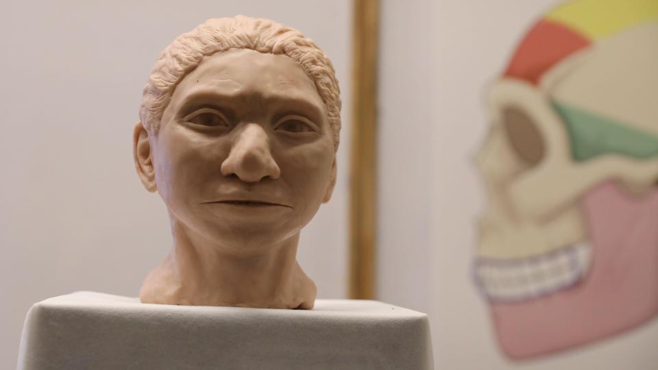 The artistic rendering of the head and face of a 13-year-old girl from the the prehistoric human species, Denisovan.