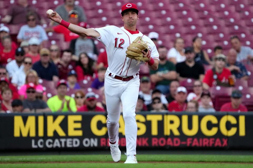 Cincinnati Reds third baseman Spencer Steer (12) throws to first base for an out during the first inning of a baseball game against the Colorado Rockies, Friday, Sept. 2, 2022, at Great American Ball Park in Cincinnati. 