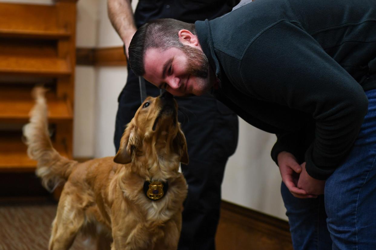 Ryan Lauseng gets inspected by police dog Leo for the third annual Novem-Burn for the Operation Hope Fund on Thursday, Nov. 30, 2023 at Carnegie Town Hall in Sioux Falls.