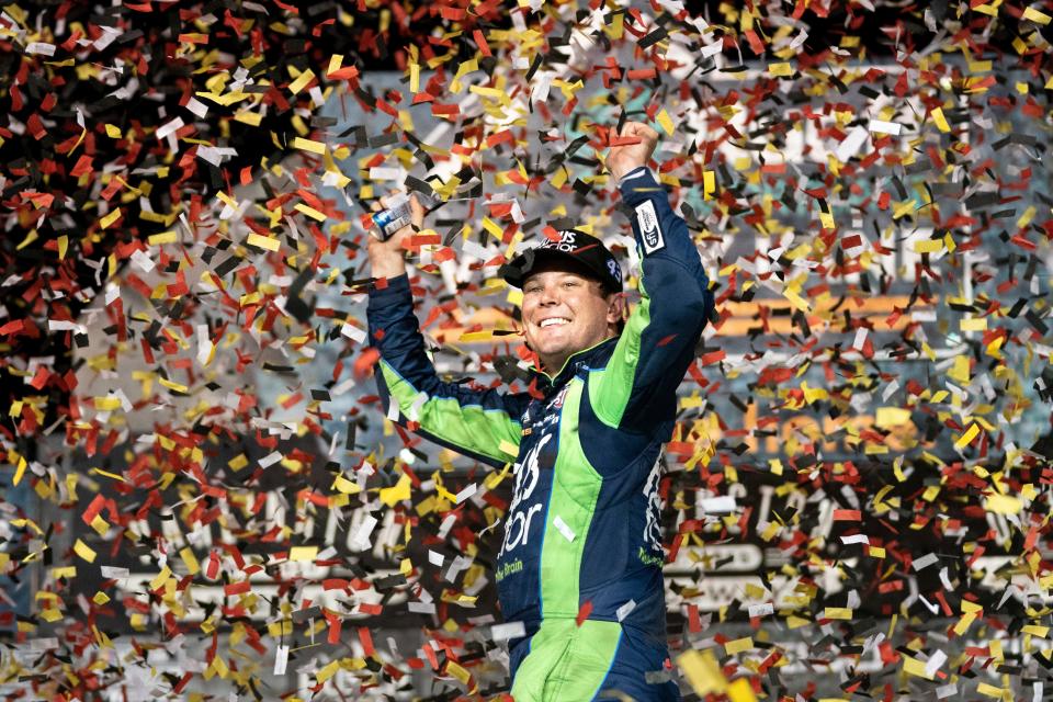 Erik Jones celebrates in the Winner's Circle after the NASCAR Southern 500 auto race Sunday, Sept. 4, 2022, in Darlington, S.C. Jones held on to the victory after taking the lead from Kyle Busch, who blew a motor with 30 laps remaining. (AP Photo/Sean Rayford)