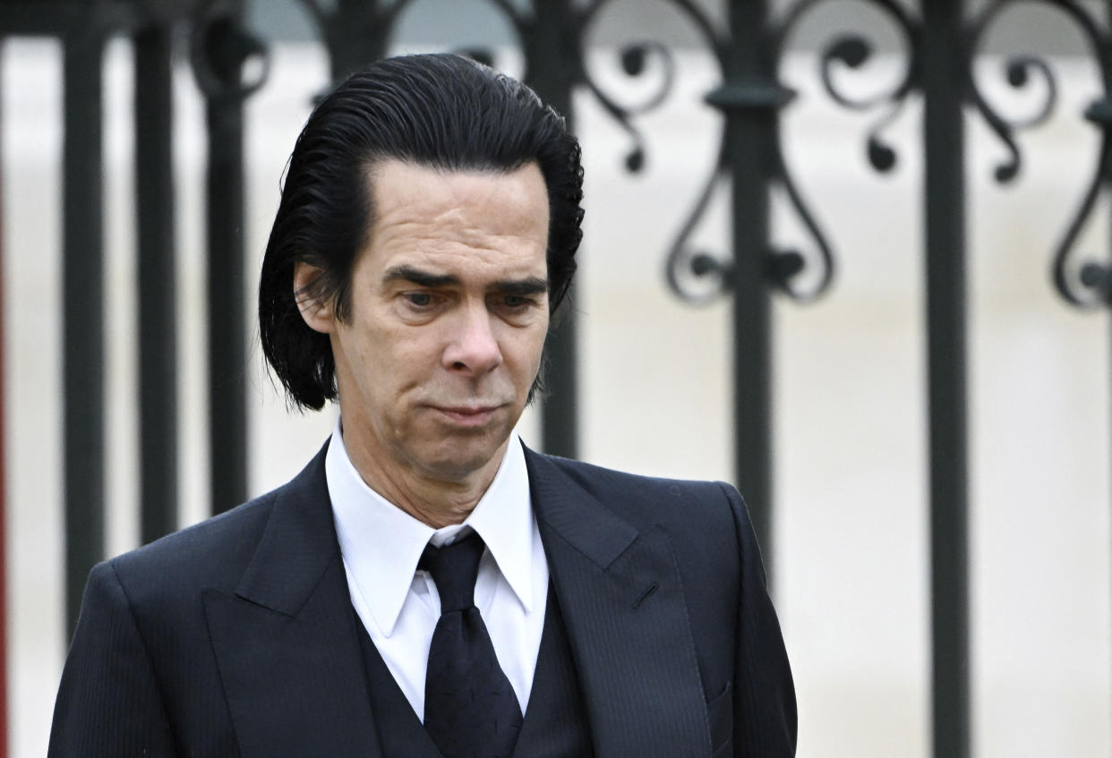 Australian singer-songwriter Nick Cave walks near Westminster Abbey on the day of Britain's King Charles and Queen Camilla's coronation ceremony, in London, Britain May 6, 2023. (Toby Melville, Pool via AP)