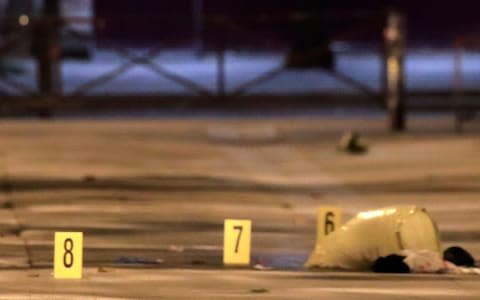 Evidences are seen on the pavement after seven people were wounded in knife attack downtown Paris  - Credit: GONZALO FUENTES /Reuters