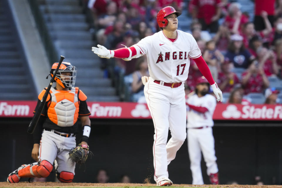 Los Angeles Angels designated hitter Shohei Ohtani (17) drops hit bat after hitting a home run during the third inning of a baseball game against the Baltimore Orioles Friday, July 2, 2021, in Anaheim. (AP Photo/Ashley Landis)