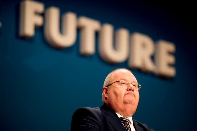 Man beneath a sign saying Future