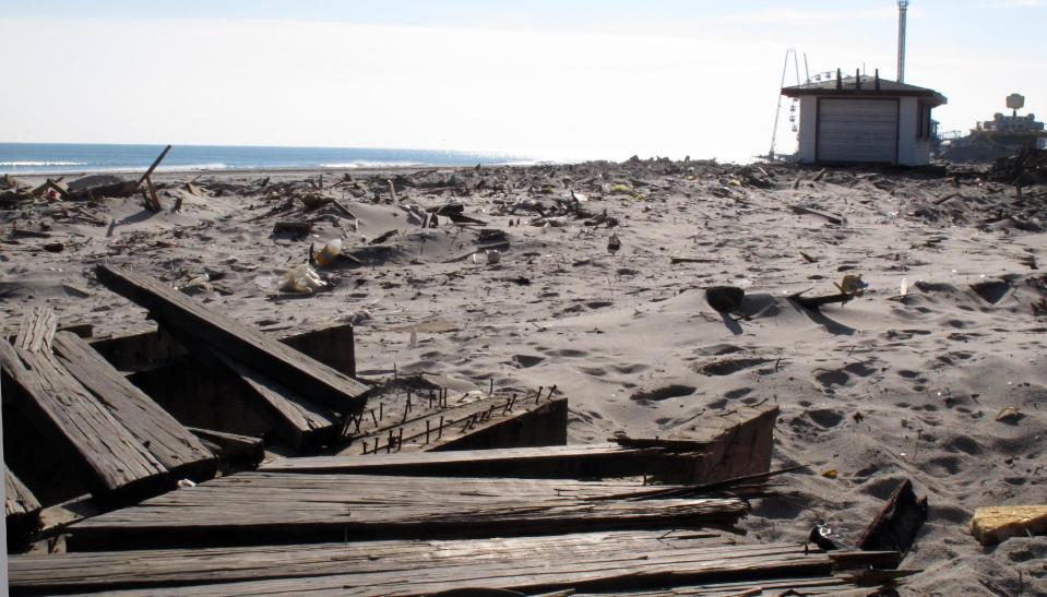 In this Nov. 29, 2012 photo, sand and rubble sit where the boardwalk used to be in Seaside Heights N.J. Seaside Heights, like many other coastal towns, is racing to rebuild its boardwalk from Superstorm Sandy's damage in time for next summer's tourism season. (AP Photo/Wayne Parry)